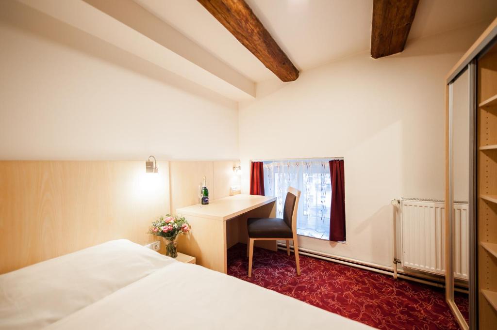 Postel nebo postele na pokoji v ubytování Hotel Pivovar