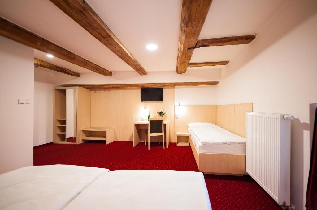 Postel nebo postele na pokoji v ubytování Hotel Pivovar