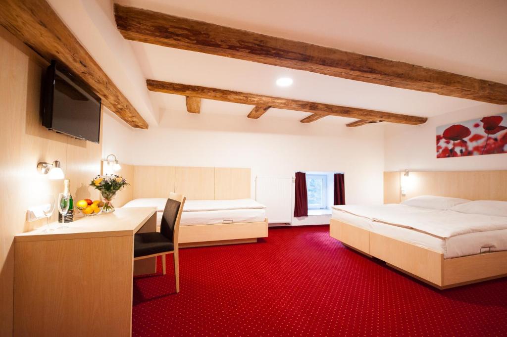 Postel nebo postele na pokoji v ubytování Hotel Pivovar
