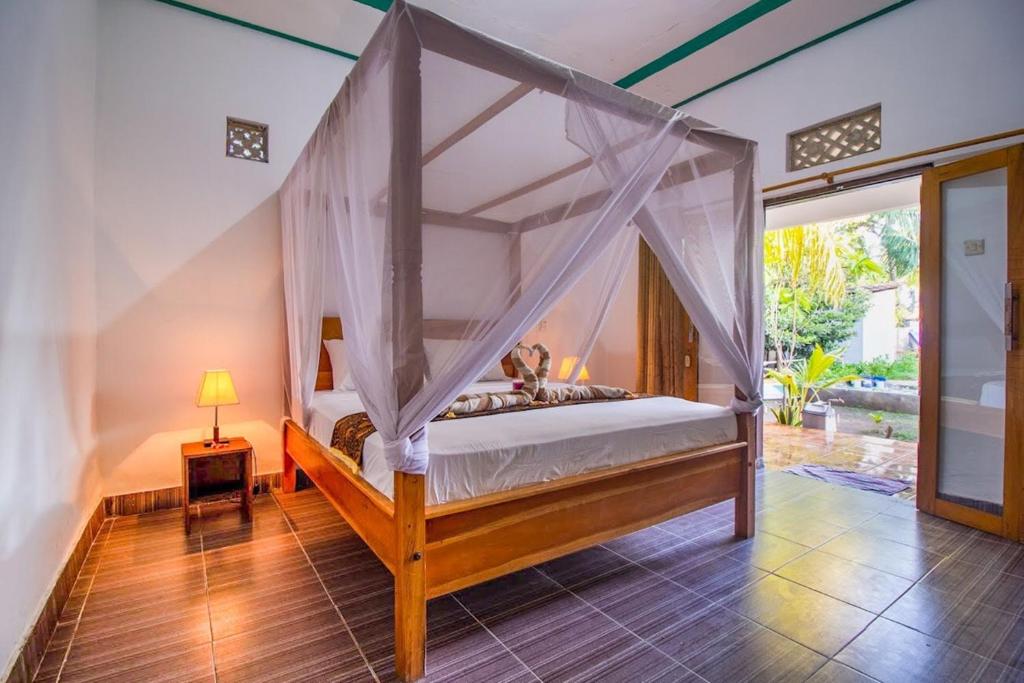 Cama ou camas em um quarto em Balengku Homestay