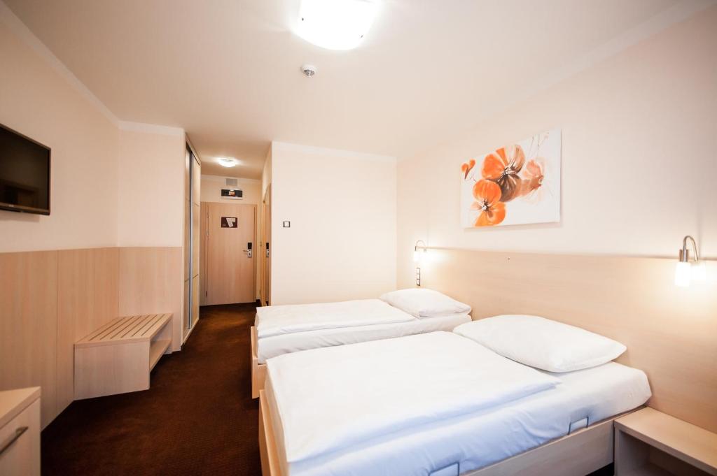 Postel nebo postele na pokoji v ubytování Hotel Pivovar