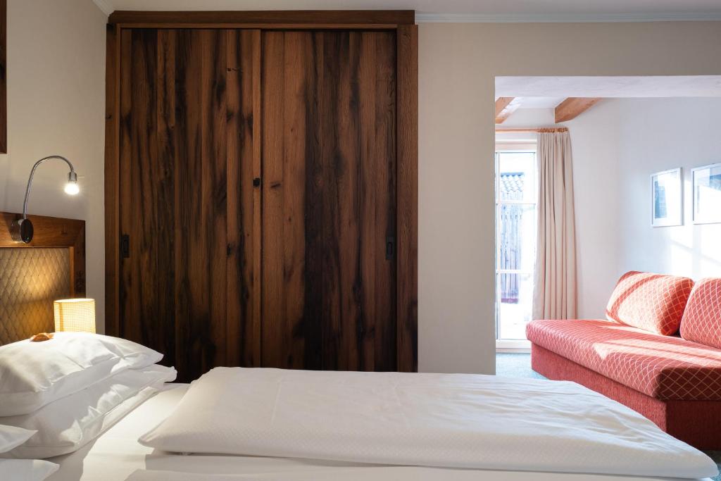 Postel nebo postele na pokoji v ubytování Hotel Senningerbräu