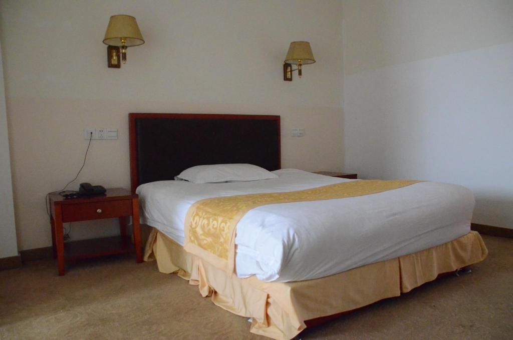 Voodi või voodid majutusasutuse Soluxe Club International Hotel toas