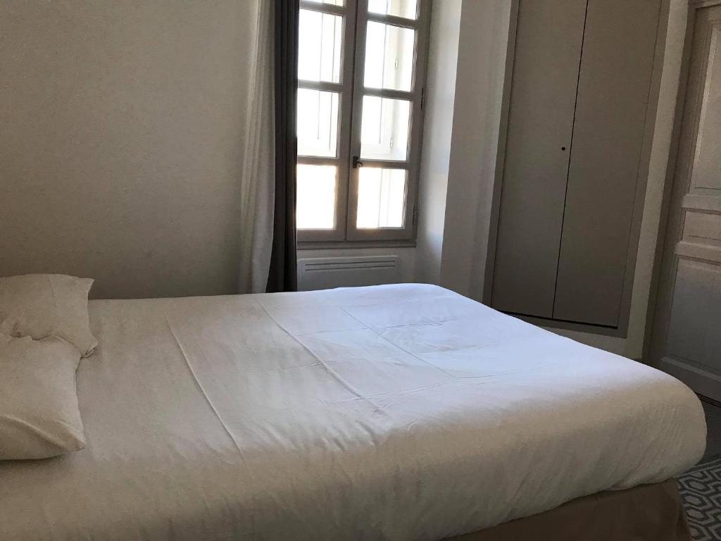 Postel nebo postele na pokoji v ubytování L'Annexe Plaisance - Hôtel Non Climatisé