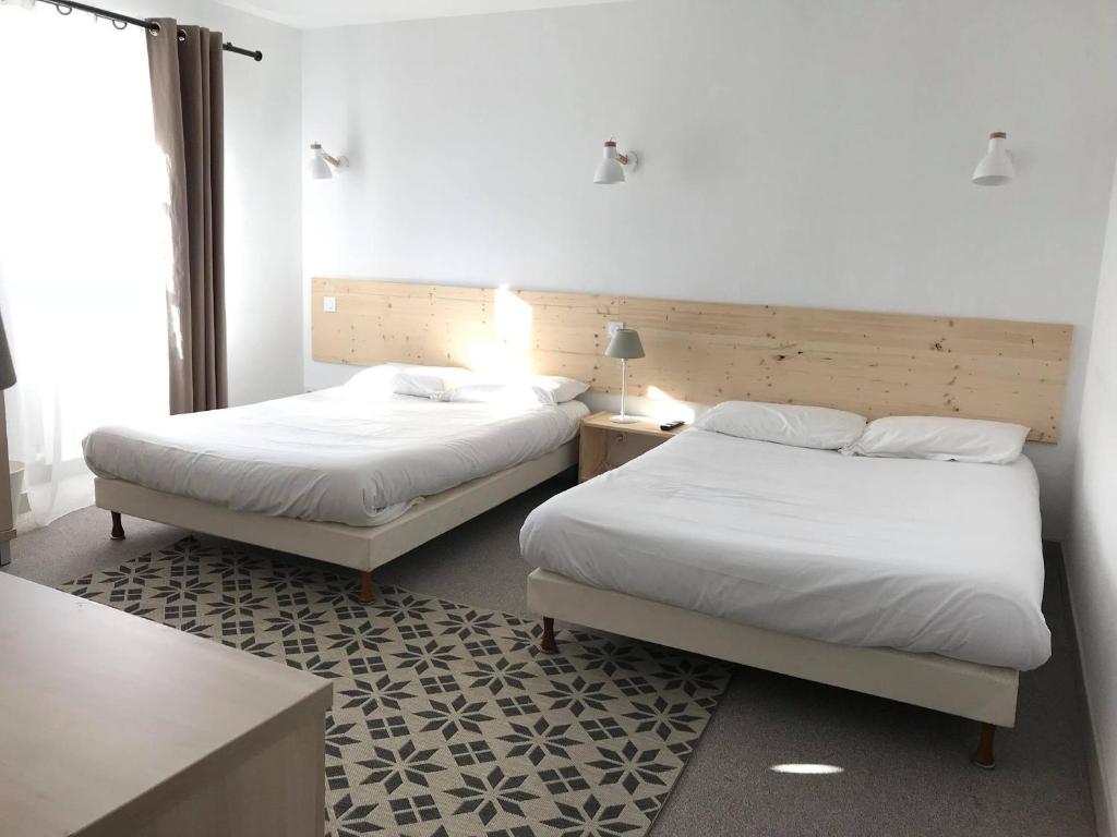Postel nebo postele na pokoji v ubytování L'Annexe Plaisance - Hôtel Non Climatisé