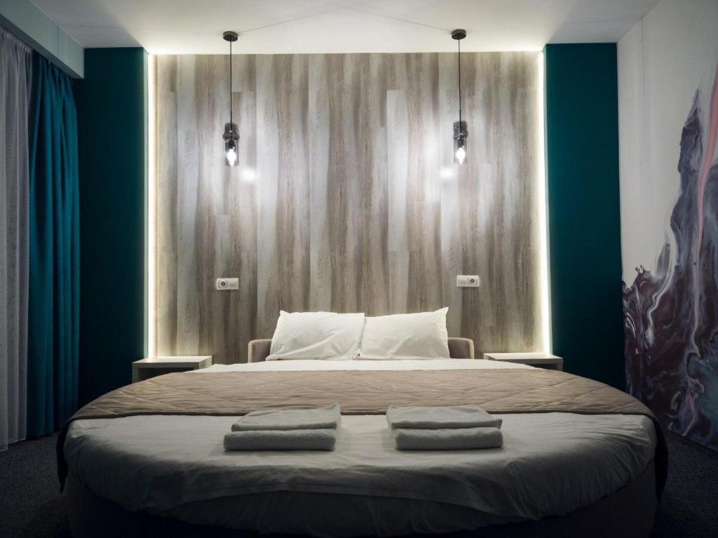 Postel nebo postele na pokoji v ubytování Art Hotel Palma