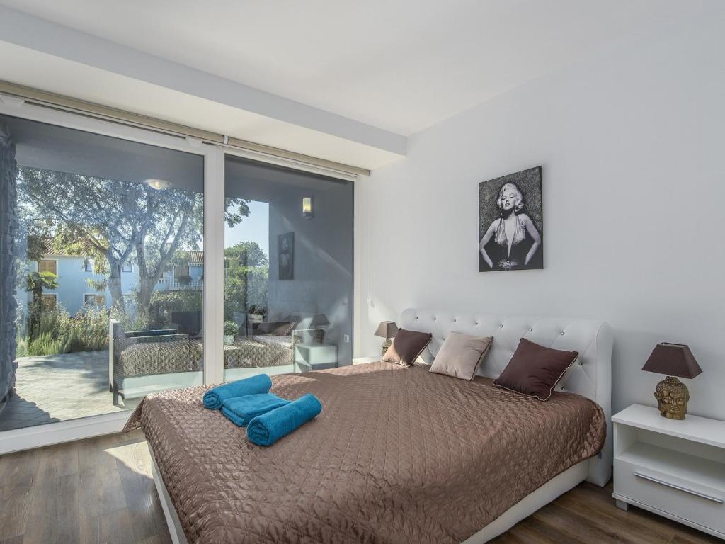 Postel nebo postele na pokoji v ubytování Apartment Monika with private pool in Porec