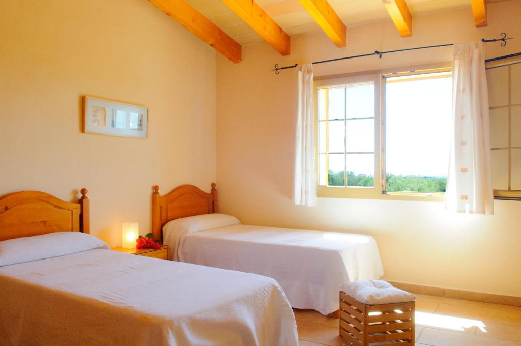 Posteľ alebo postele v izbe v ubytovaní Finca Cullera