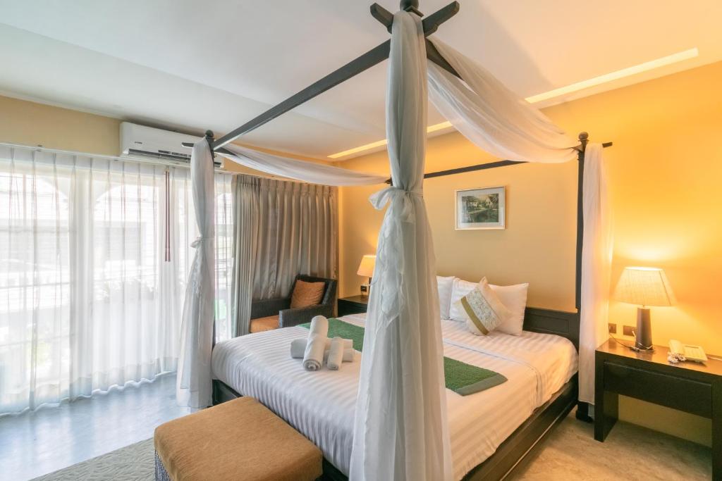 Postel nebo postele na pokoji v ubytování Baan PhuAnda Phuket