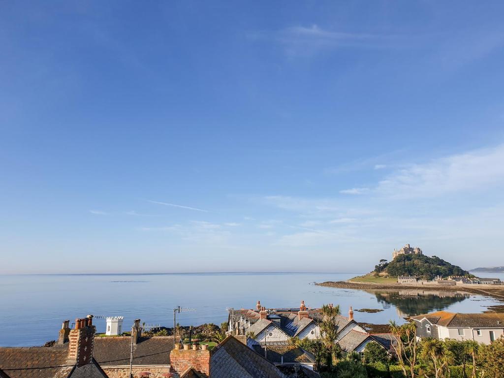 a view of an island in the water with houses at Ocean View in Marazion