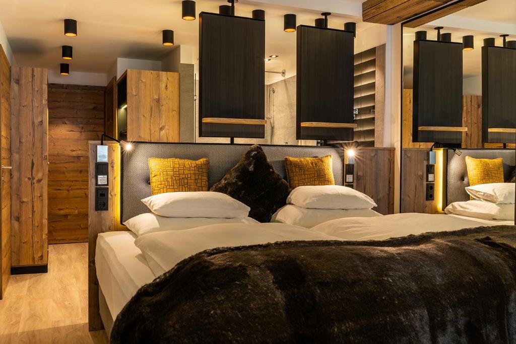Postel nebo postele na pokoji v ubytování Sporthotel Snowwhite