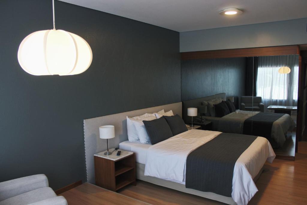 Voodi või voodid majutusasutuse Aguada Hotel toas