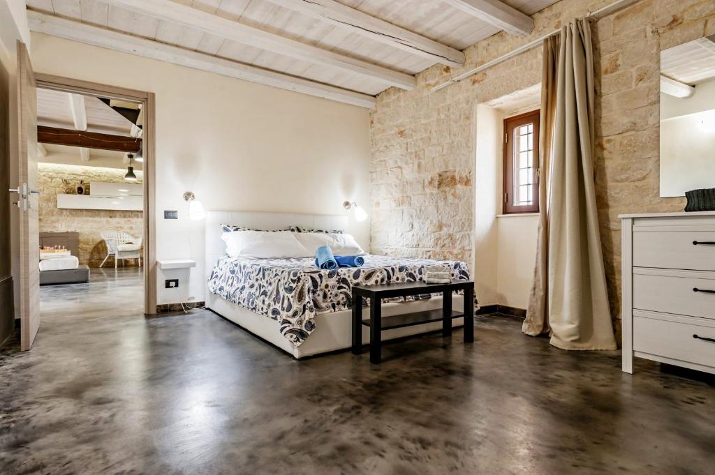 Łóżko lub łóżka w pokoju w obiekcie Villa Antica Aia Relax