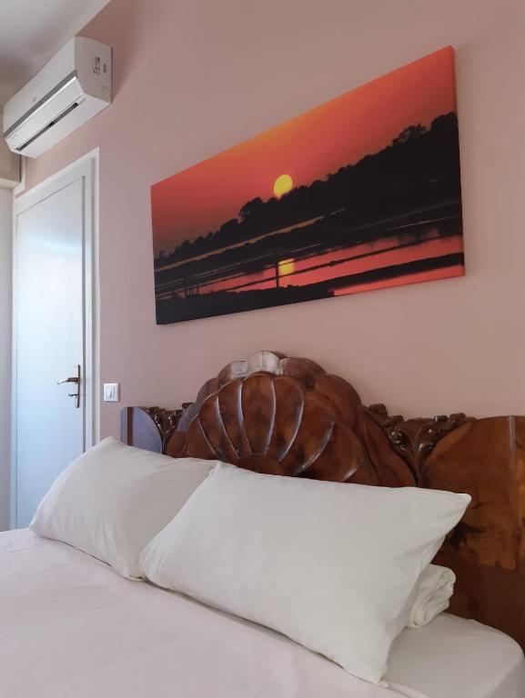 Postel nebo postele na pokoji v ubytování Le Quattro Isole
