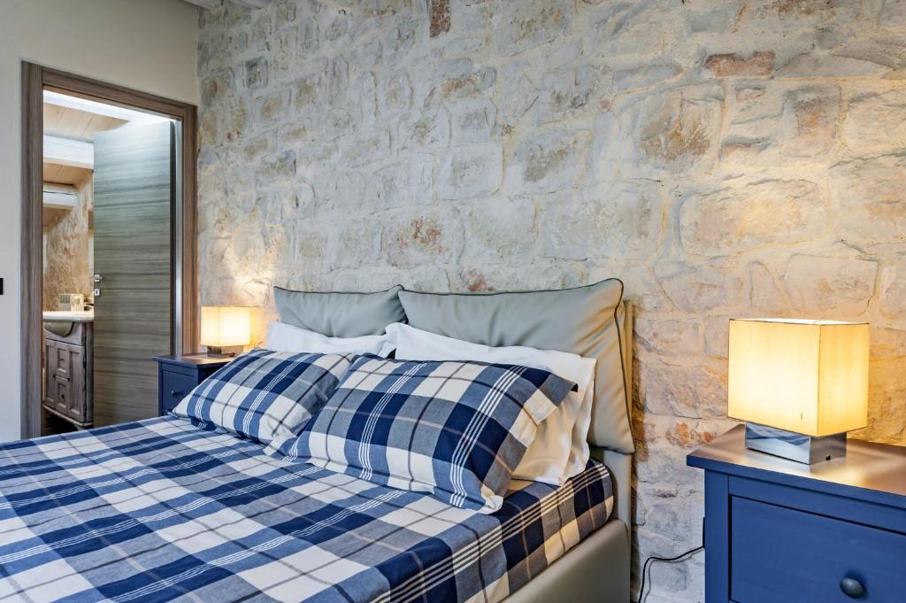 Łóżko lub łóżka w pokoju w obiekcie Villa Antica Aia Relax