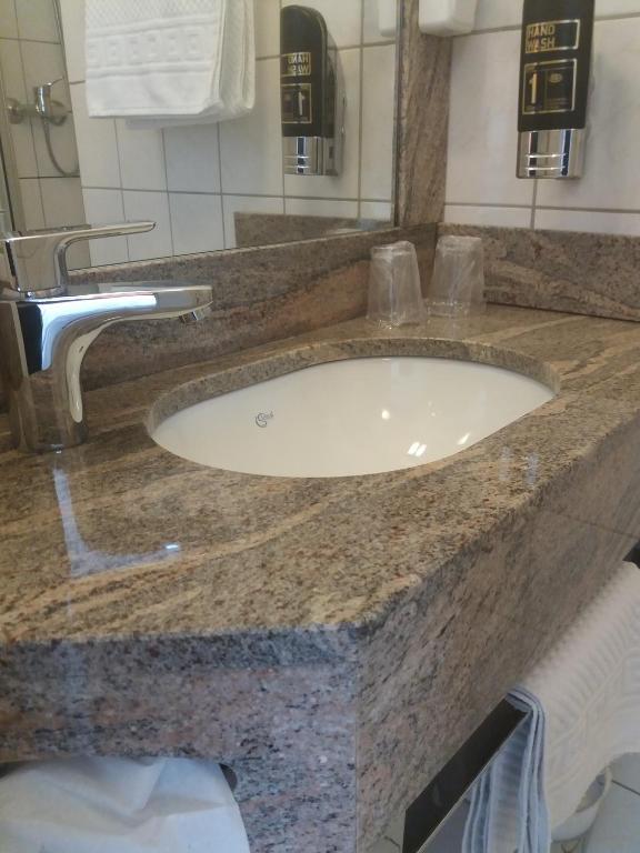 Koupelna v ubytování Hotel Garni Regent