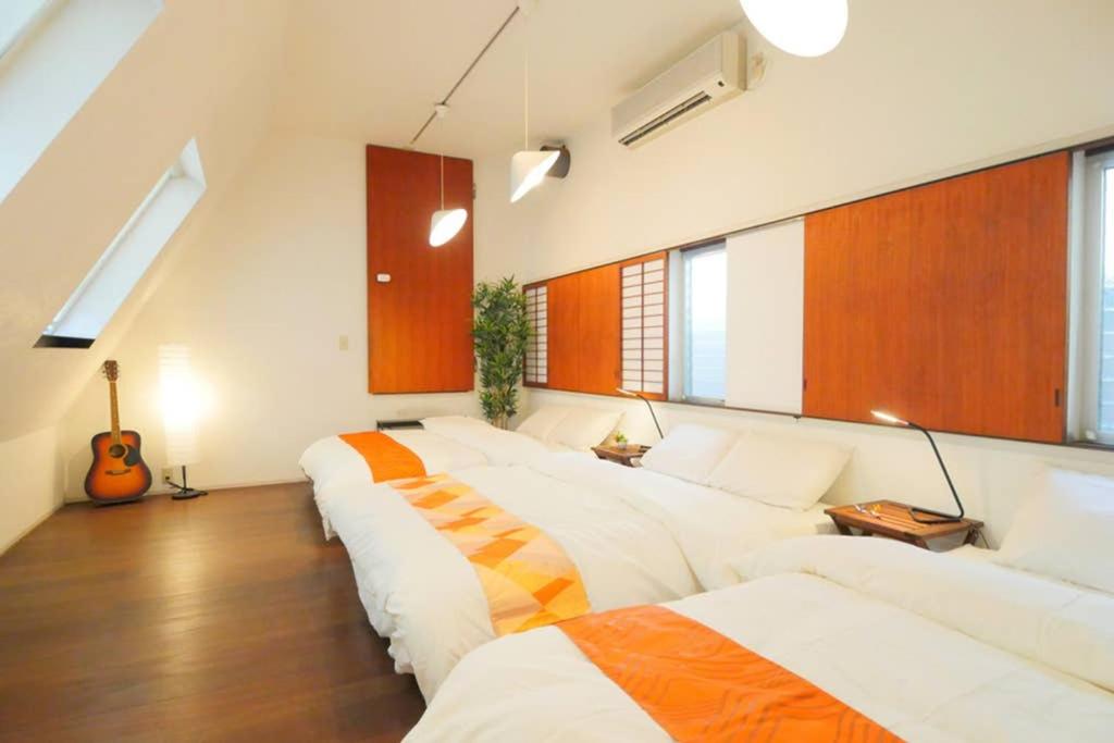 Tempat tidur dalam kamar di 大阪 忍者家 o10