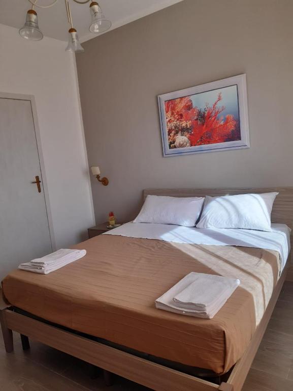 Postel nebo postele na pokoji v ubytování Le Quattro Isole