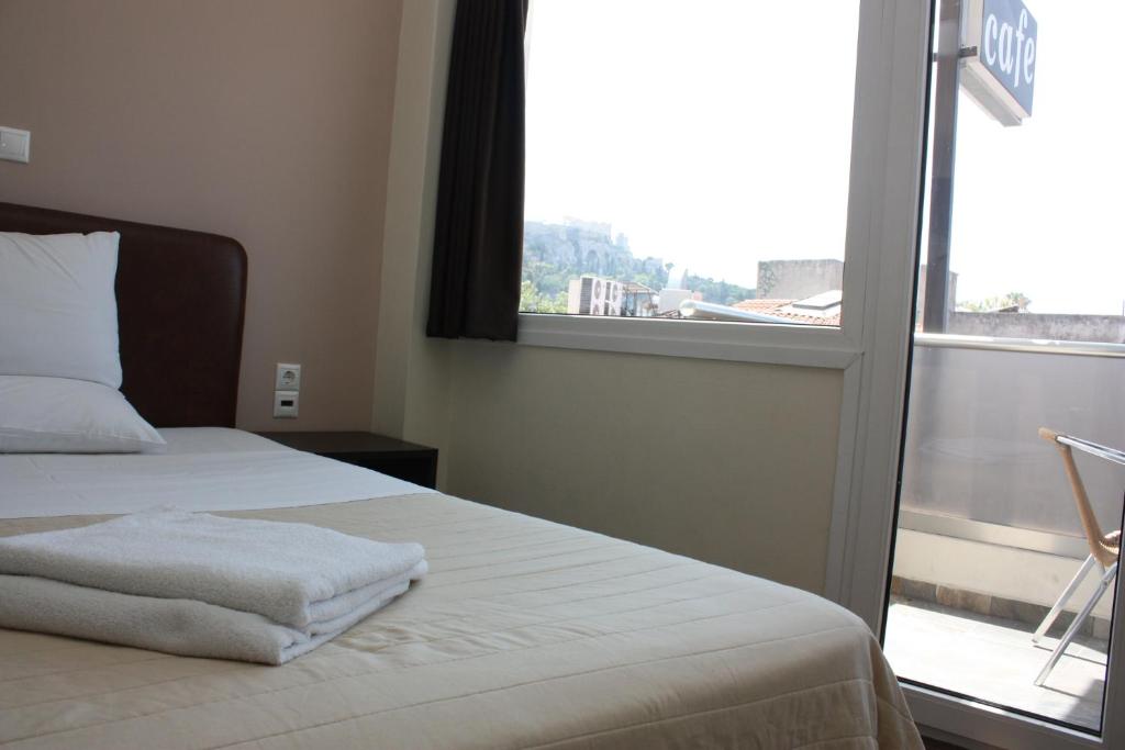 Ένα ή περισσότερα κρεβάτια σε δωμάτιο στο Pella Inn Hostel