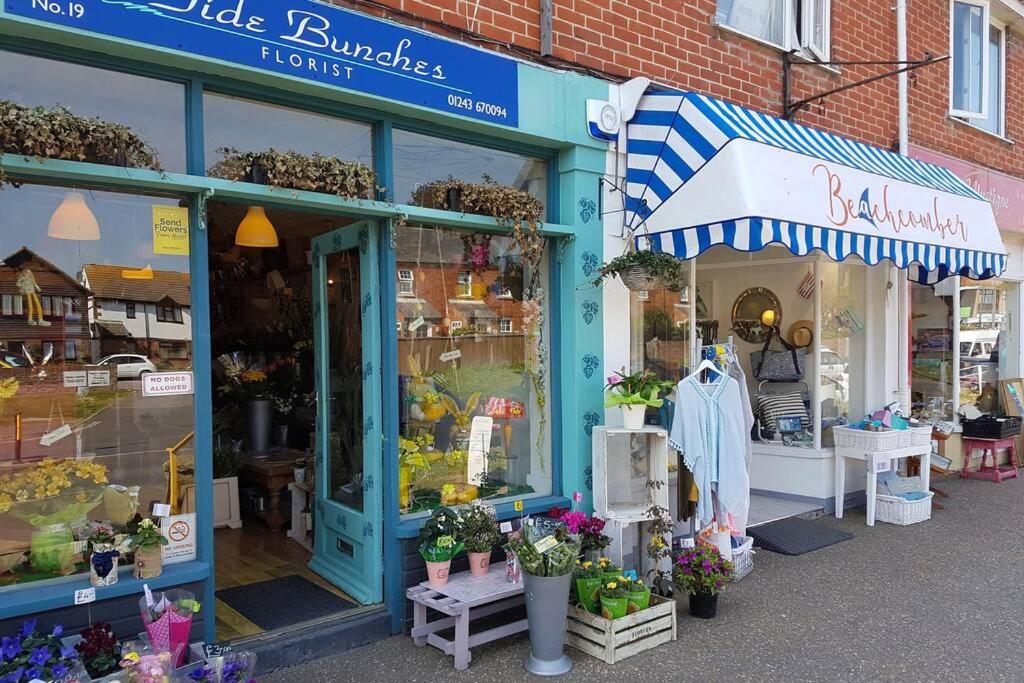 a store front of a store with flowers and plants at The Garden Room in Chichester