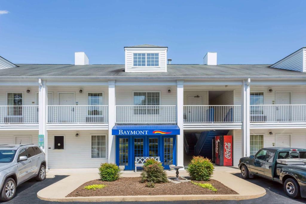 a building with cars parked in front of it at Baymont by Wyndham Eden in Eden