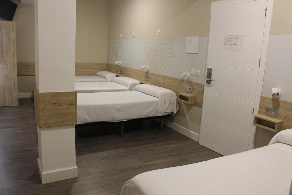 Postel nebo postele na pokoji v ubytování Deluxe Hostels & Suites Merida