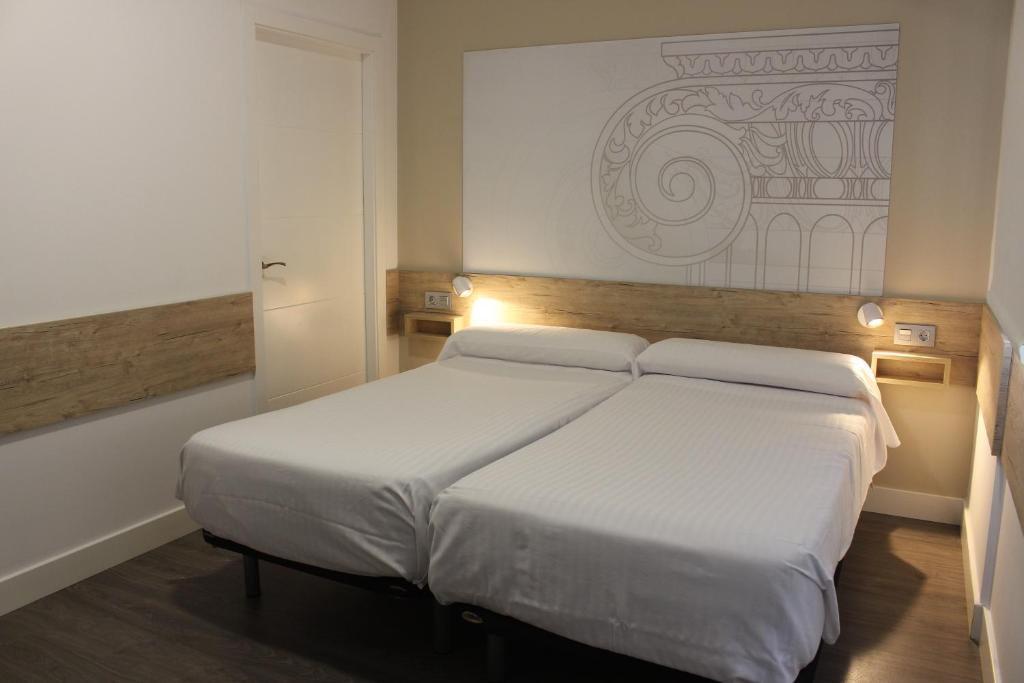 Postel nebo postele na pokoji v ubytování Deluxe Hostels & Suites Merida