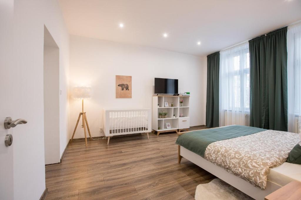 Postel nebo postele na pokoji v ubytování FAMILY Apartment OSTRAVA