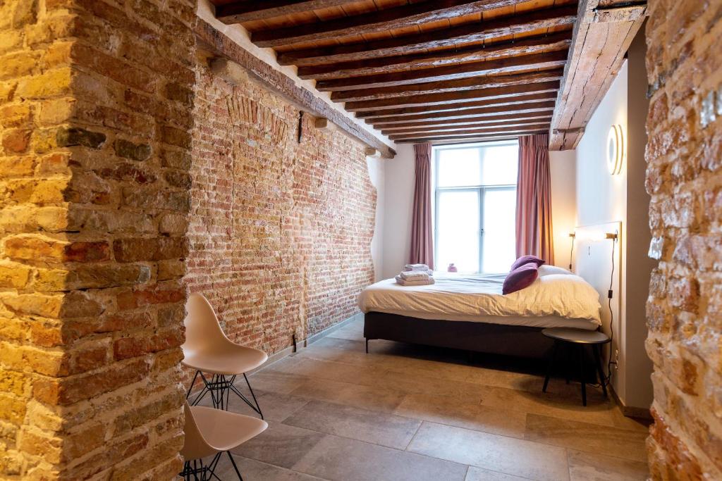 Postel nebo postele na pokoji v ubytování La Clé Brugge