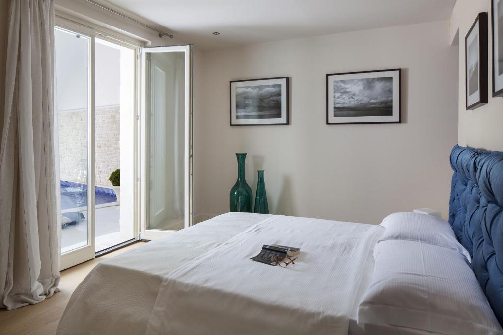 Postel nebo postele na pokoji v ubytování Villa Frida by HMZ Villas