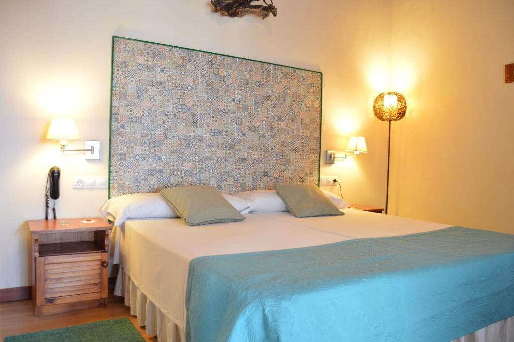 Postel nebo postele na pokoji v ubytování Gara Hotel