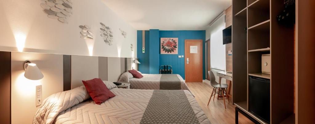 Postel nebo postele na pokoji v ubytování Hotel Olympus