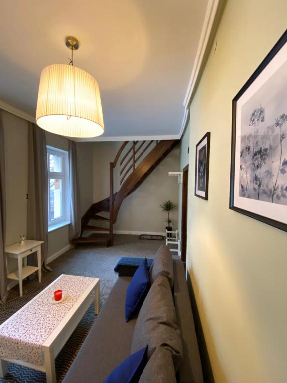 Posezení v ubytování CIENISTA 7 APARTMENTS