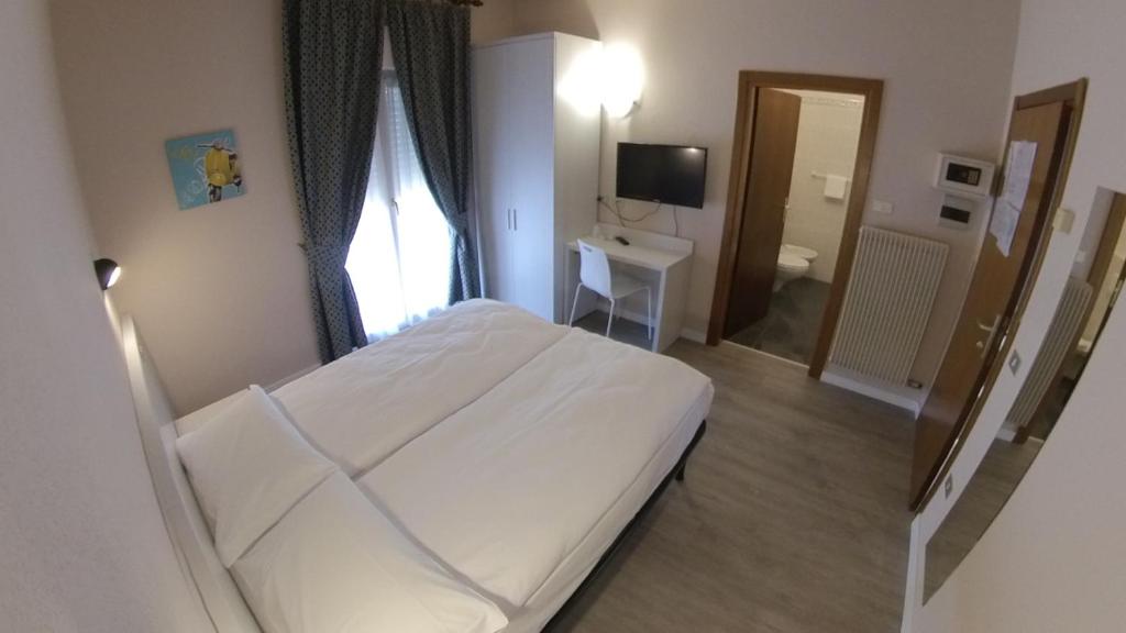 Postel nebo postele na pokoji v ubytování Hotel Alberello