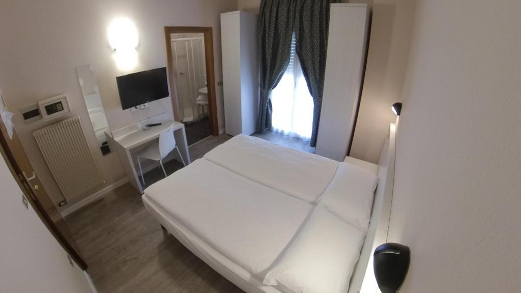Postel nebo postele na pokoji v ubytování Hotel Alberello