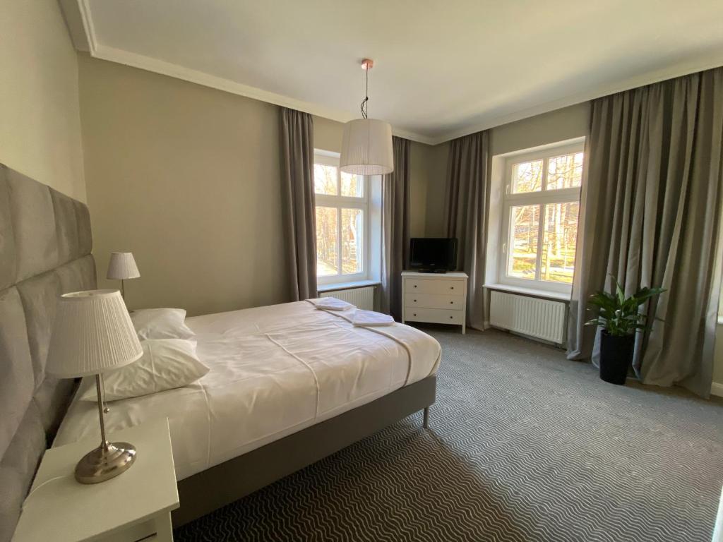 TV a/nebo společenská místnost v ubytování CIENISTA 7 APARTMENTS
