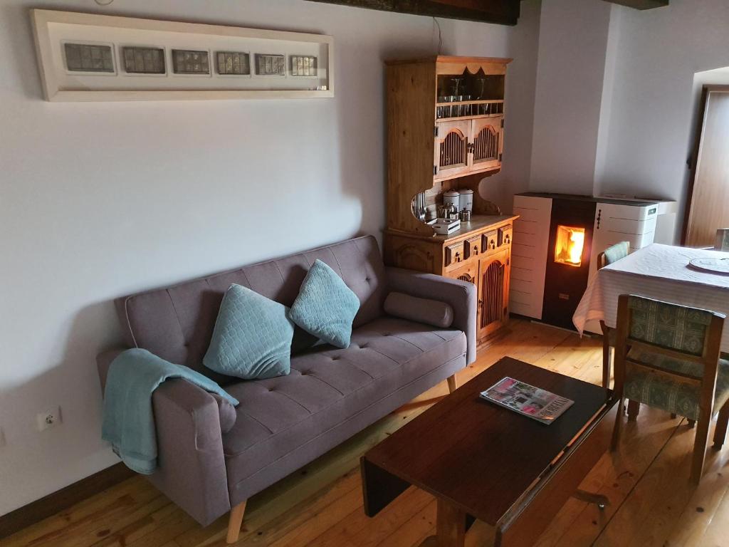 a living room with a couch and a table at Apto La Fabrica de Paños Brihuega in Brihuega