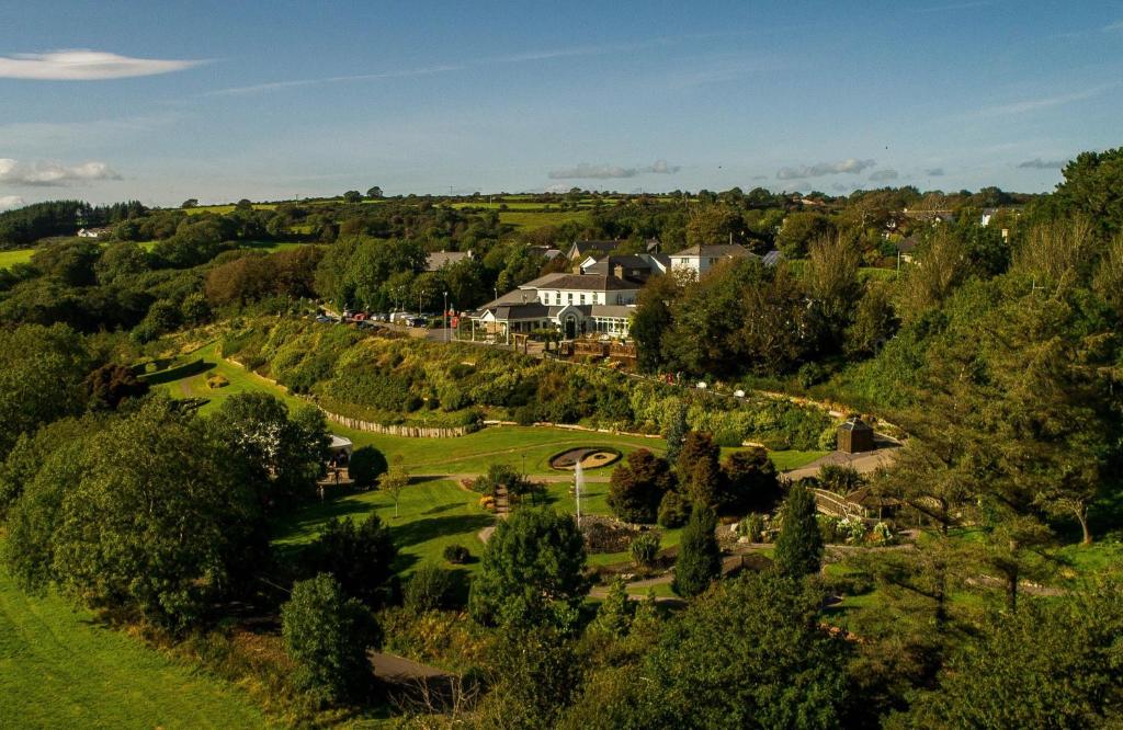 an aerial view of a village with houses and trees at Fernhill House Hotel & Gardens in Clonakilty