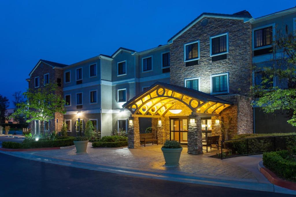 a building with an archway in front of a building at Staybridge Suites Irvine East/Lake Forest by IHG in Lake Forest