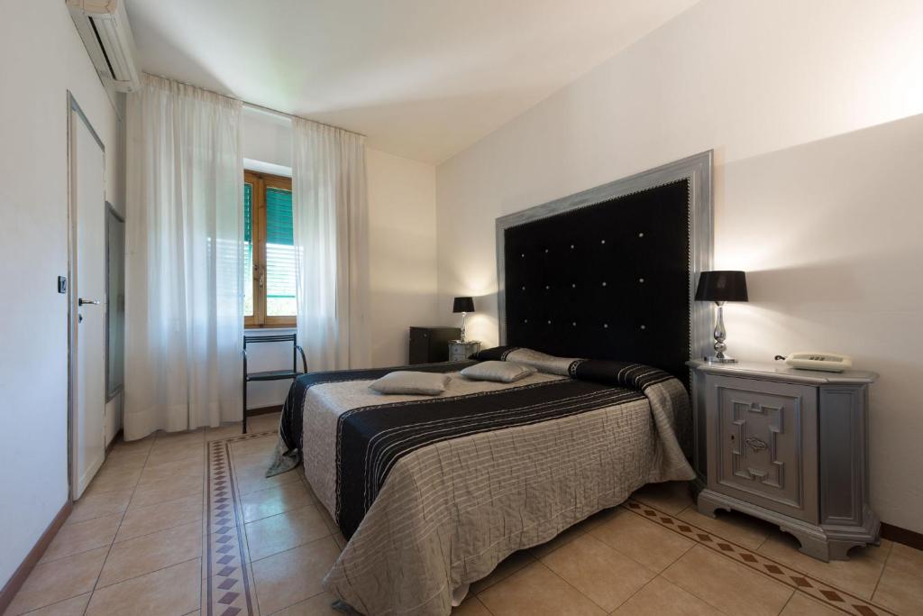 Posteľ alebo postele v izbe v ubytovaní Hotel Corallo