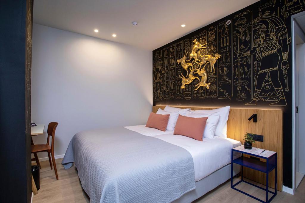 Postel nebo postele na pokoji v ubytování Artist Hotel - an Atlas Boutique Hotel