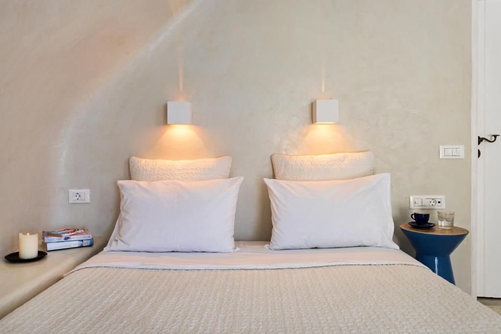 Postel nebo postele na pokoji v ubytování Porto Fira Suites