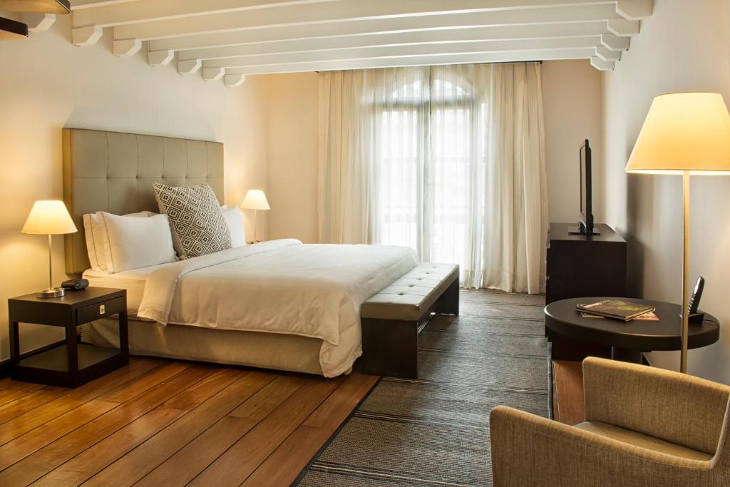 Postel nebo postele na pokoji v ubytování Movich Casa del Alferez