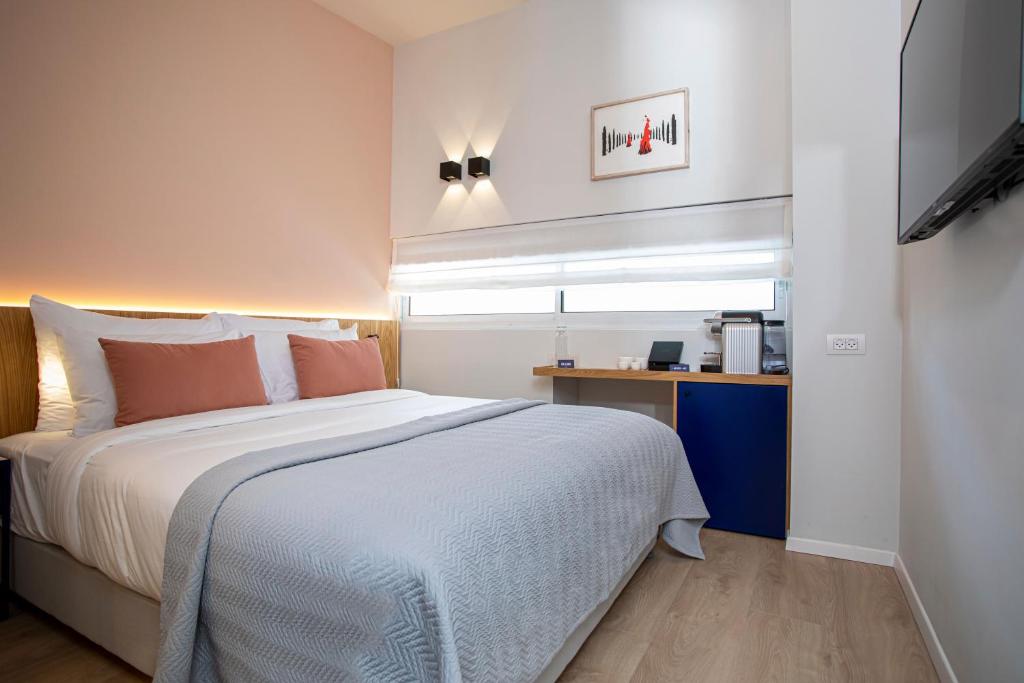 Postel nebo postele na pokoji v ubytování Artist Hotel - an Atlas Boutique Hotel