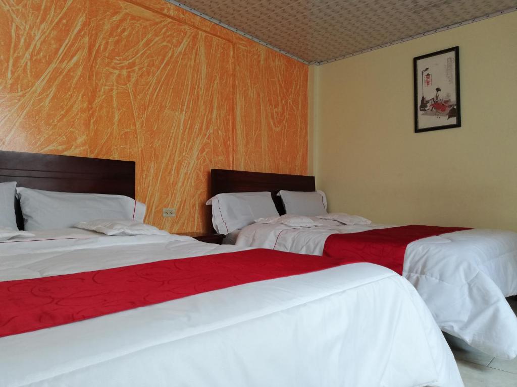 Postel nebo postele na pokoji v ubytování Hotel Gun Glub