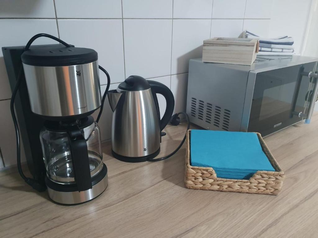 Příslušenství pro přípravu čaje a kávy v ubytování White Pearl Hostel 2