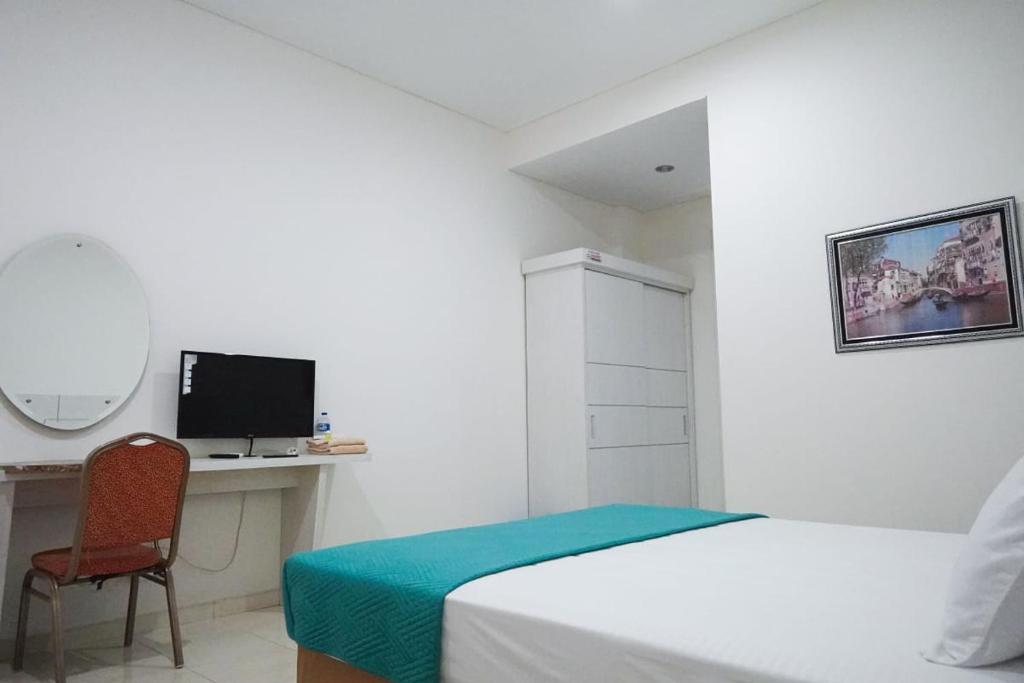 TV a/nebo společenská místnost v ubytování Surokarsan Residence