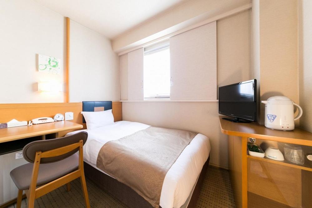Postel nebo postele na pokoji v ubytování Pearl Hotel Ryogoku