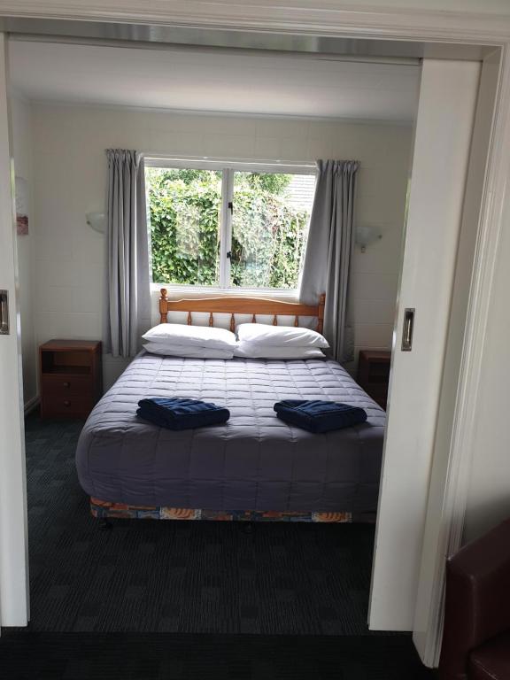 Postel nebo postele na pokoji v ubytování Milton Chalet Motel