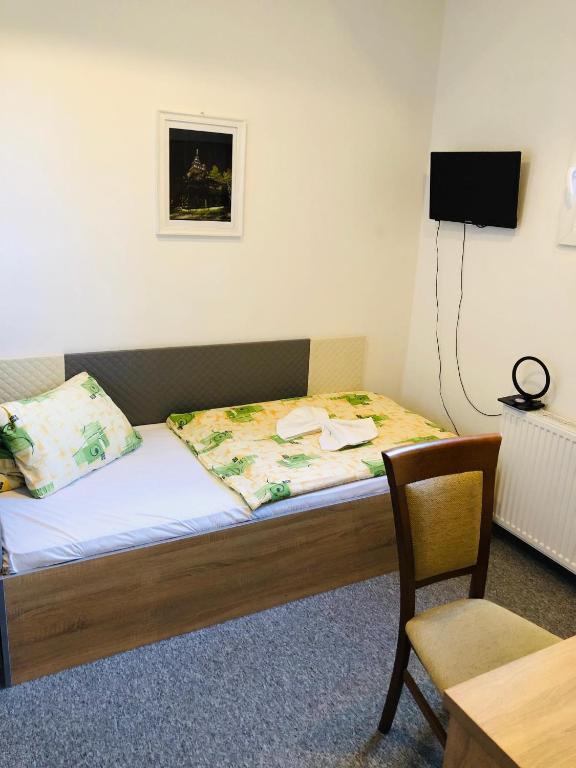 Postel nebo postele na pokoji v ubytování Hotel Piast